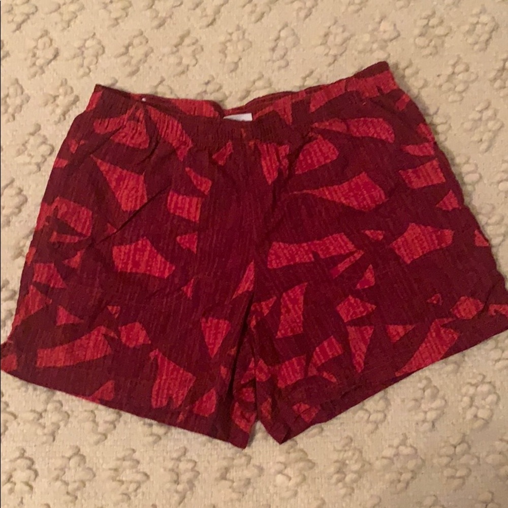 Red and burgundy patterned Columbia water shorts